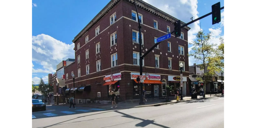 a red brick building on the corner of a street