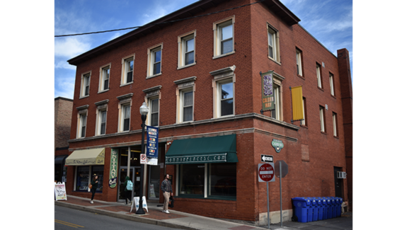 a red brick building on the corner of a street