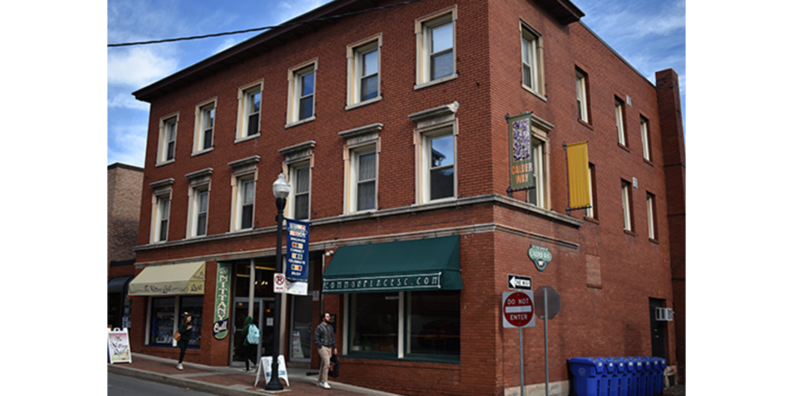 a red brick building on the corner of a street
