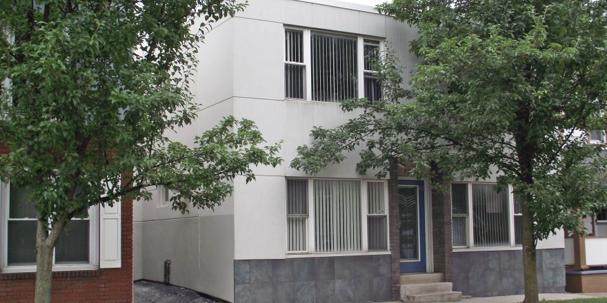 Exterior of two-story building with stucco