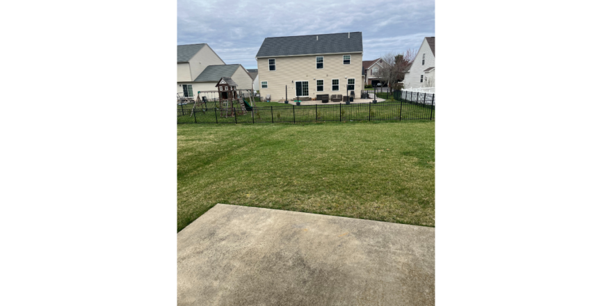 a house with a fence in front of it