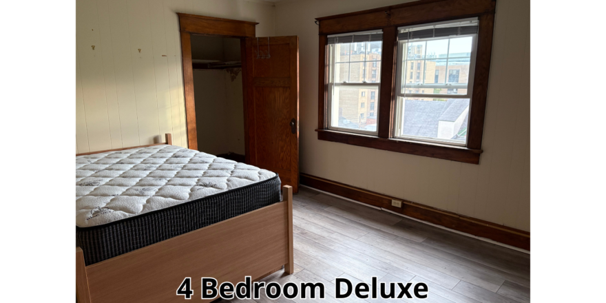 a bed room with a bed and a window