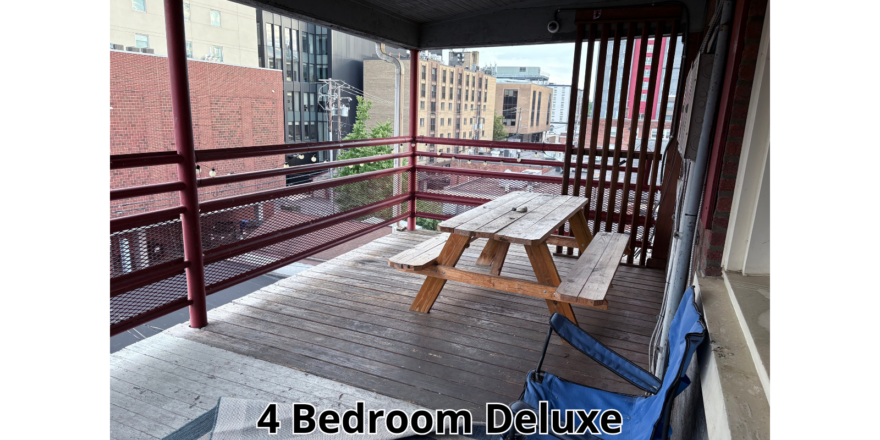 a wooden bench sitting on top of a wooden deck