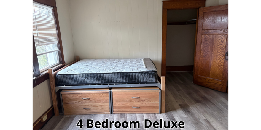 a bedroom with a bed and a dresser