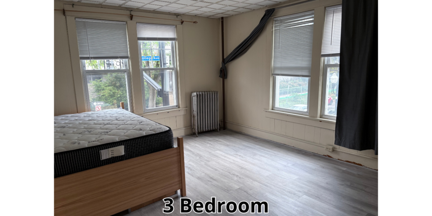 a bed room with a bed a window and a radiator