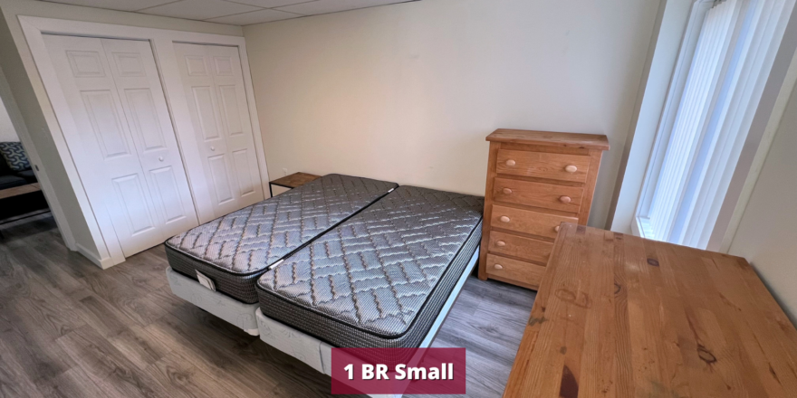 Bedroom with two beds and two dressers