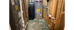 a water heater in a room with a lot of wires