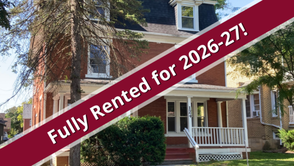 a house with a red ribbon in front of it
