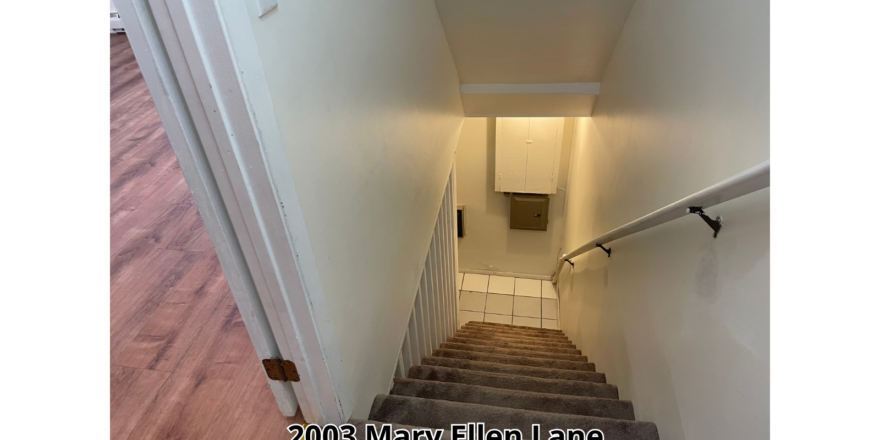 a stairway leading up to a toilet in a bathroom