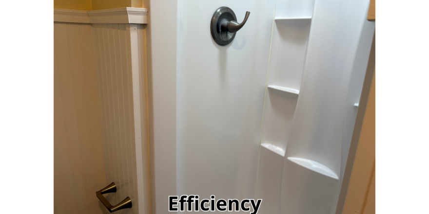 a bathroom with a toilet and a shower