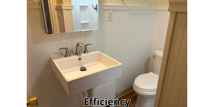 a bathroom with a sink, toilet and mirror