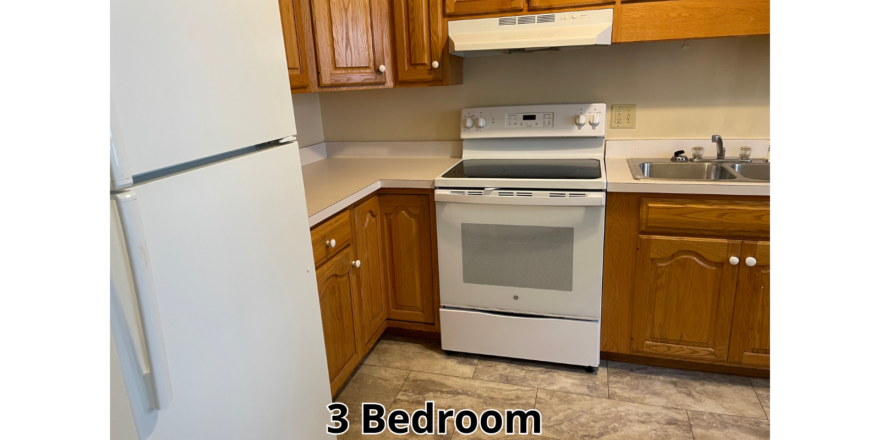 a kitchen with a white stove top oven
