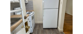 a white refrigerator freezer sitting inside of a kitchen