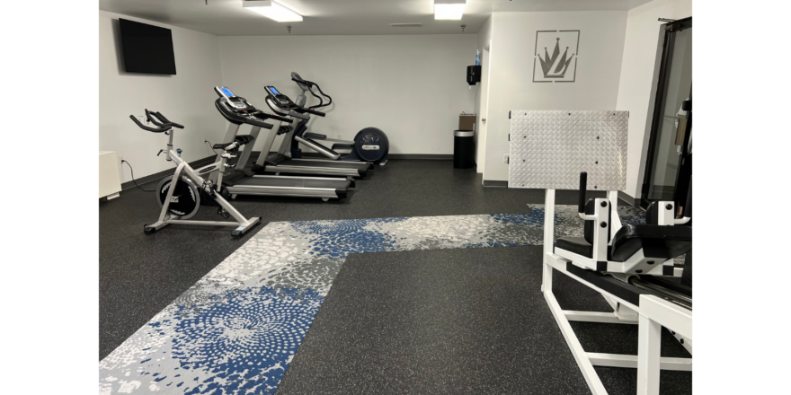 a row of exercise bikes in a gym