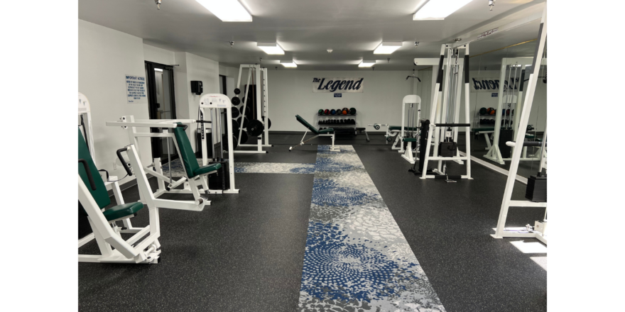 a gym filled with machines and weight machines