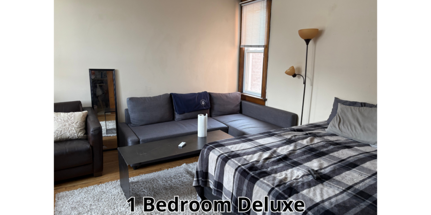 a living room with a couch and a bed