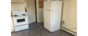 a white refrigerator freezer sitting inside of a kitchen