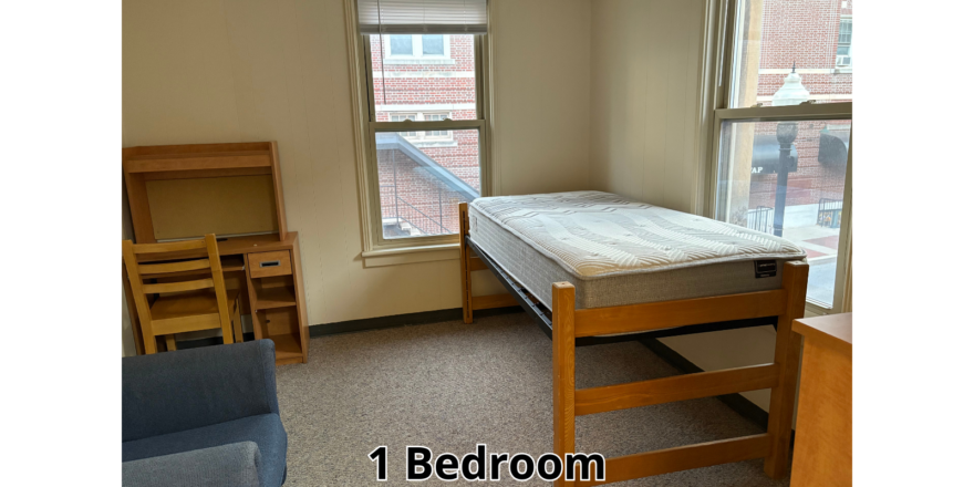 a room with a bed and a chair in it