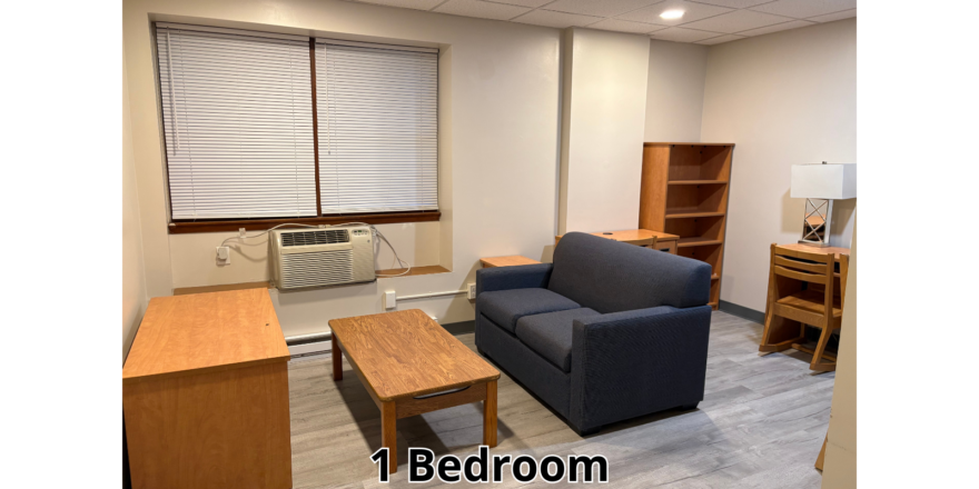 a living room filled with furniture and a window