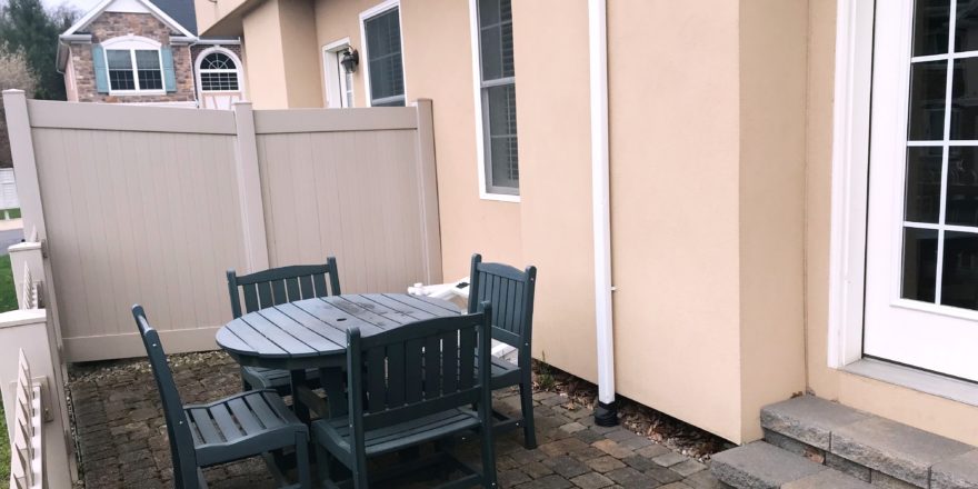 Fenced-in patio with furniture