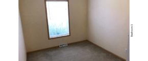 Unfurnished, carpeted bedroom with a window