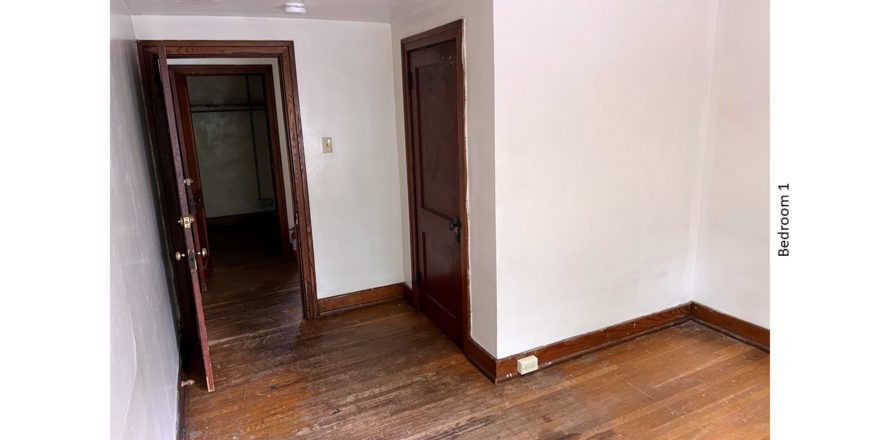 Unfurnished bedroom with hardwood floors, and closet