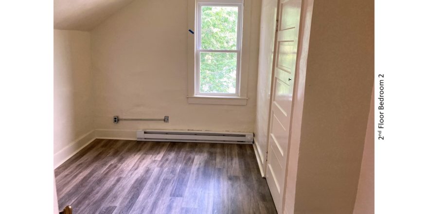 Bedroom with window and closet