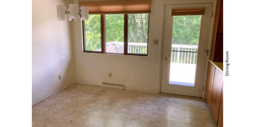 Dining room with door to deck and chandelier