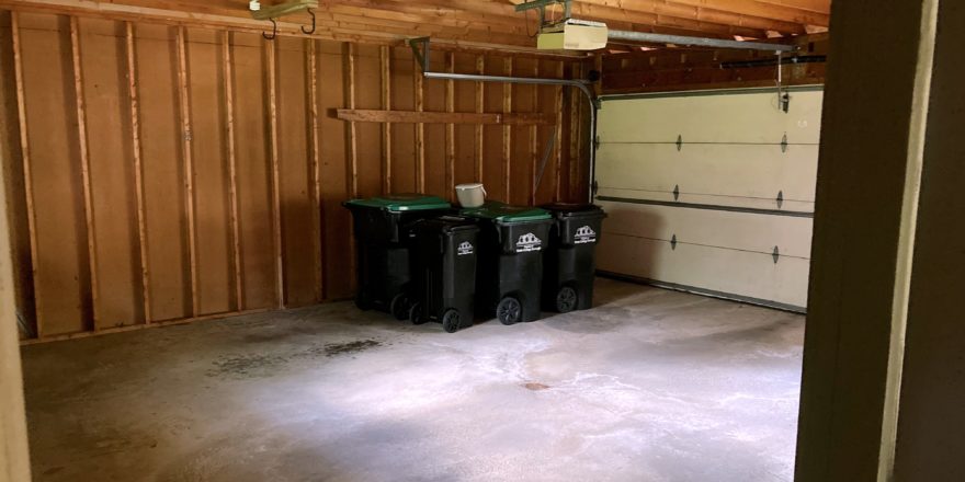 Garage with garbage and recycling bins