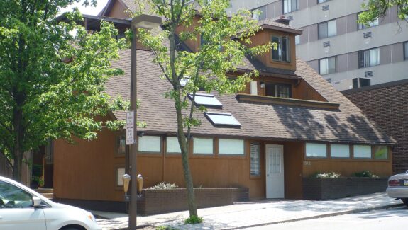 a car is parked in front of a house