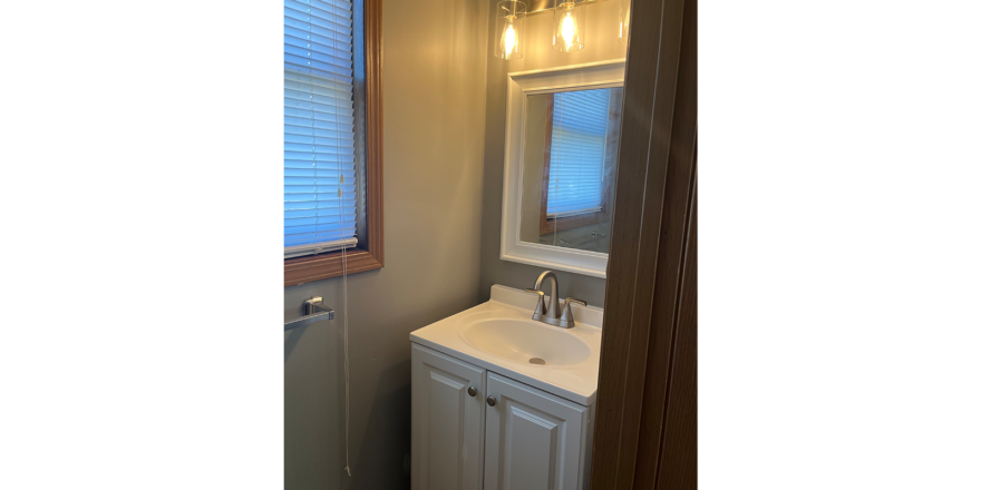 a bathroom with a sink and a vanity