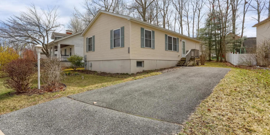a house with a driveway in front of it