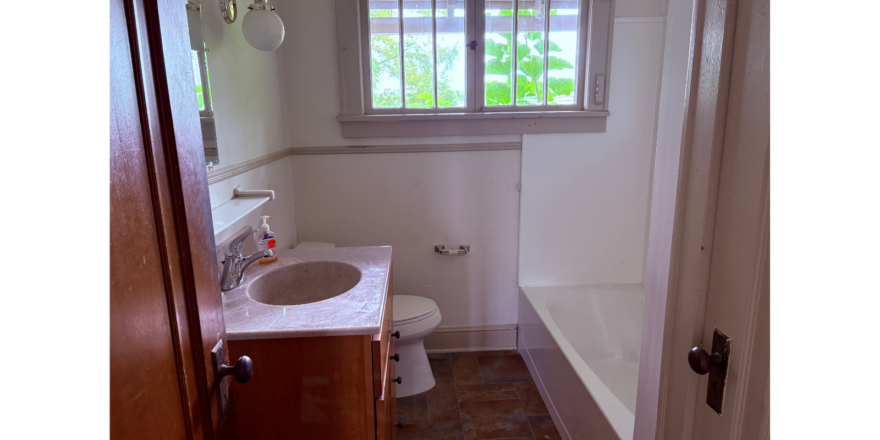a bathroom with a sink, toilet, and bathtub