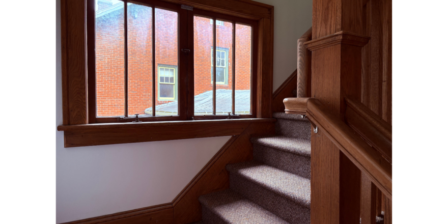 a set of stairs leading up to a window