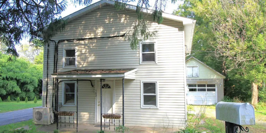 a house with a mailbox in front of it
