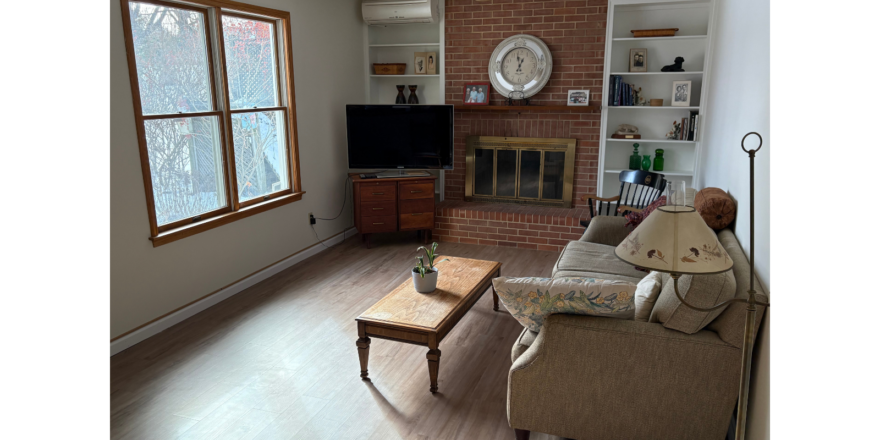 a living room filled with furniture and a fire place